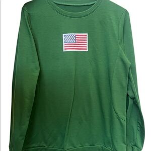 Green long sleeve “Freedom” logo.